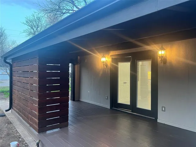 a view of room with stairs and wooden floor
