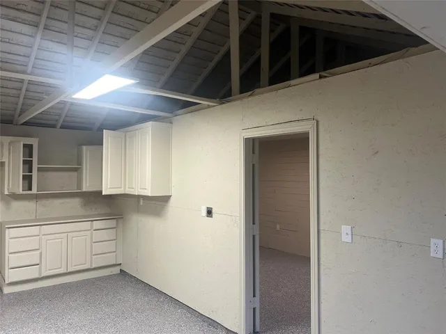 a view of cabinets and window