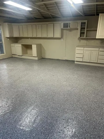 a view of a yard with large trees