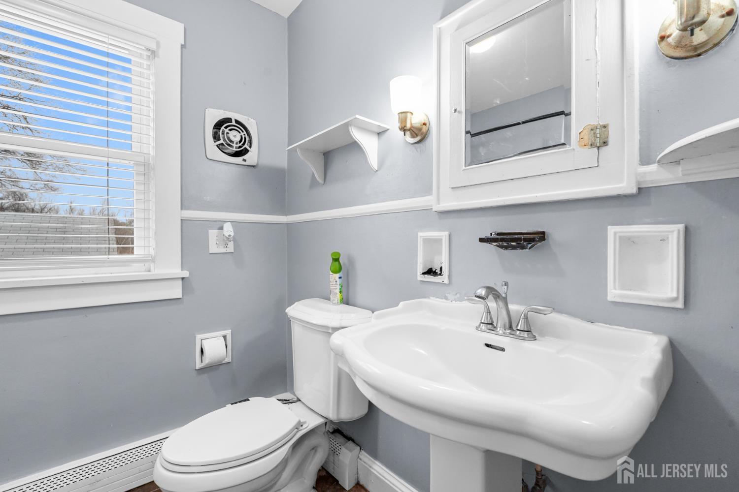 339 Plainsboro Road Plainsboro, NJ 08536 - Photo 7 of 16 a bathroom with a sink mirror and toilet