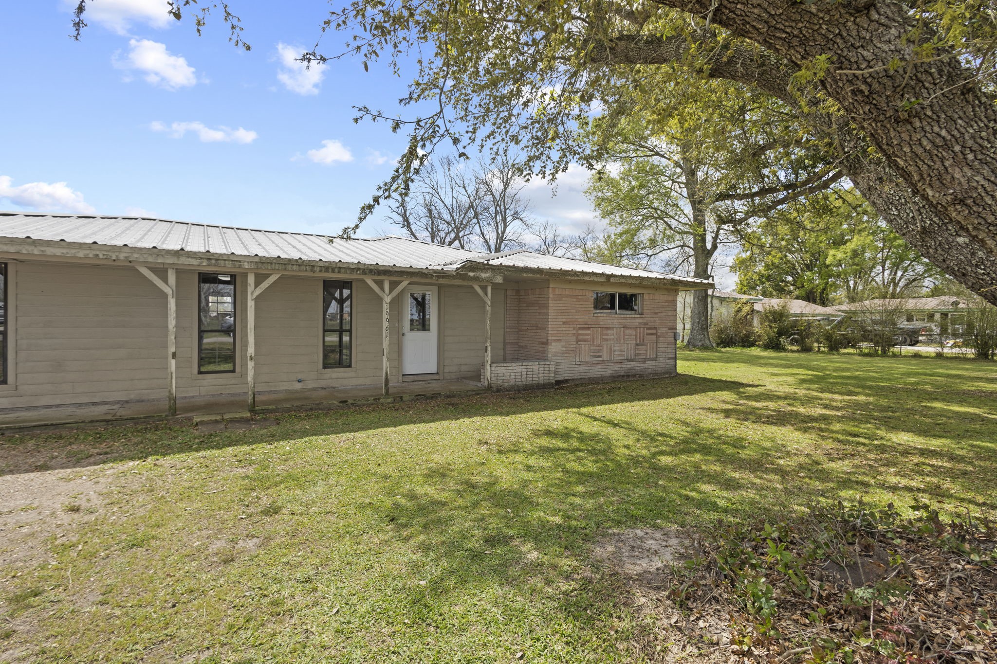 19961 Englin Road Winnie, TX 77665 - Photo 3 of 26 a backyard of a house