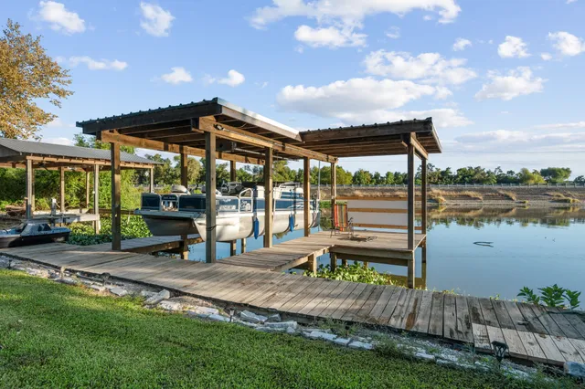 a view of a house with backyard porch and sitting area