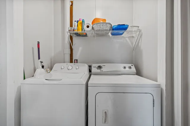a view of backyard with a barn and plants