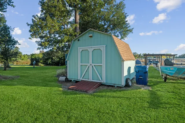 a view of a lake with a sitting space and garden