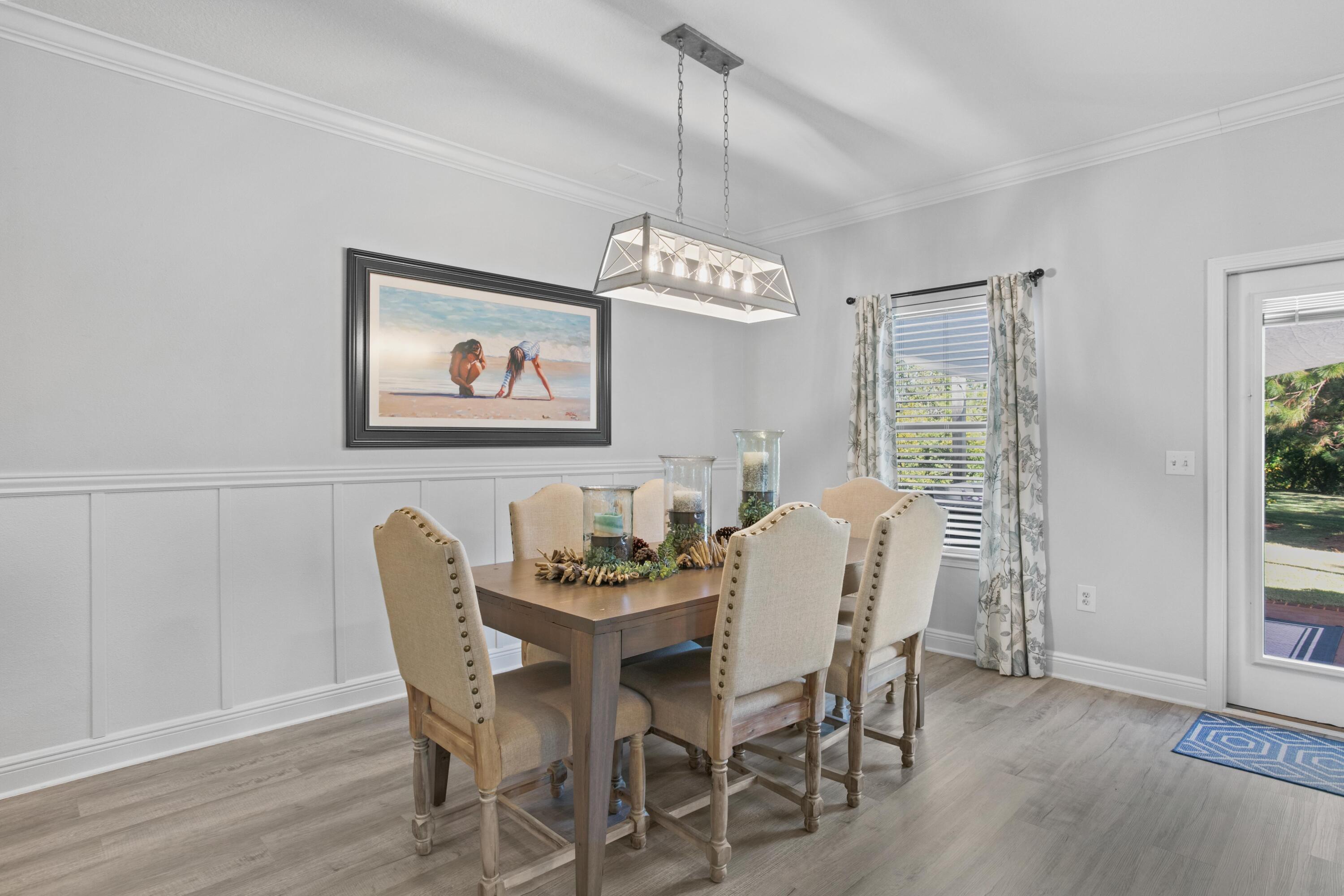 1069 Cocobolo Drive Santa Rosa Beach, FL 32459 - Photo 15 of 46 a dining room with furniture and window