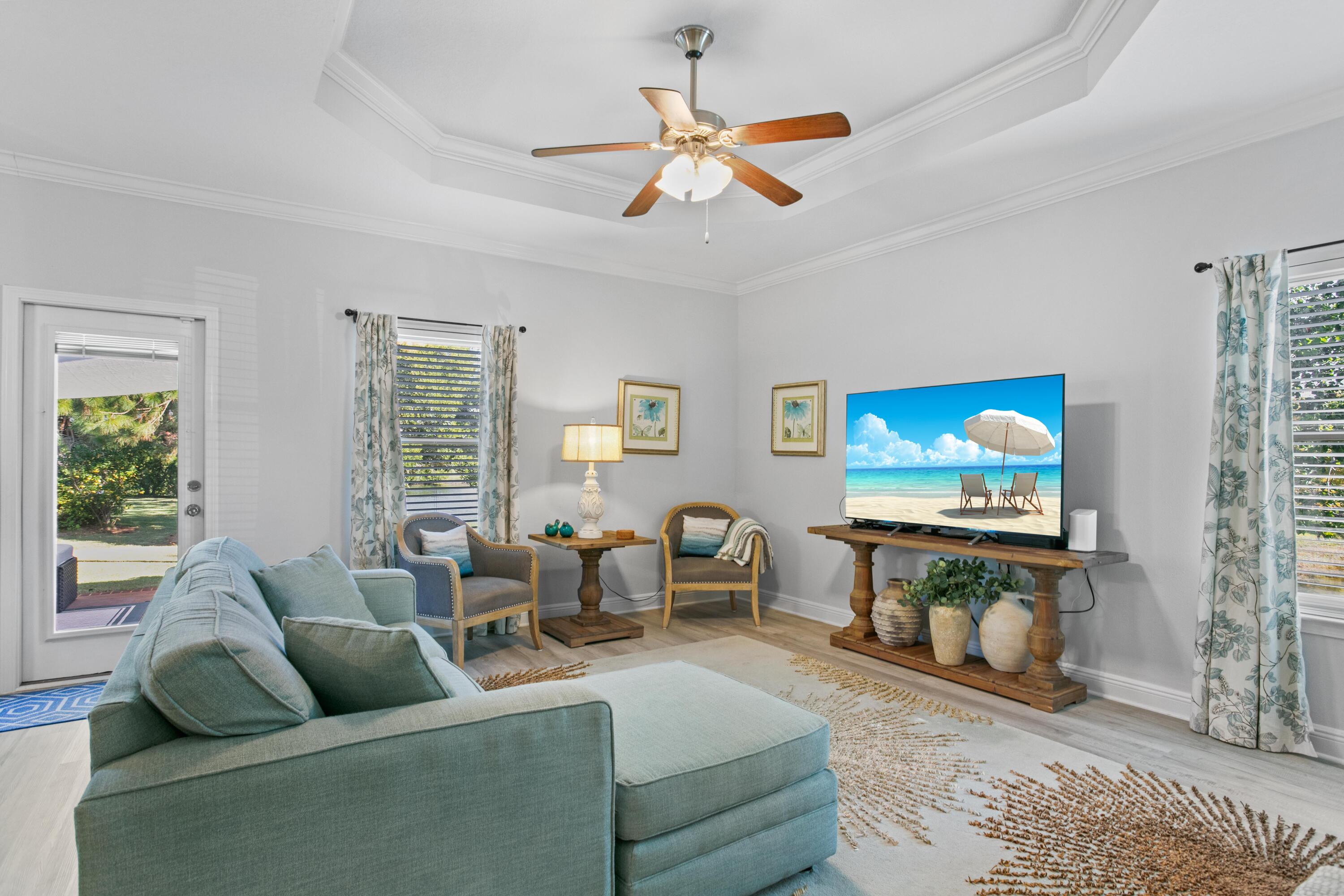 1069 Cocobolo Drive Santa Rosa Beach, FL 32459 - Photo 16 of 46 a living room with furniture and a flat screen tv