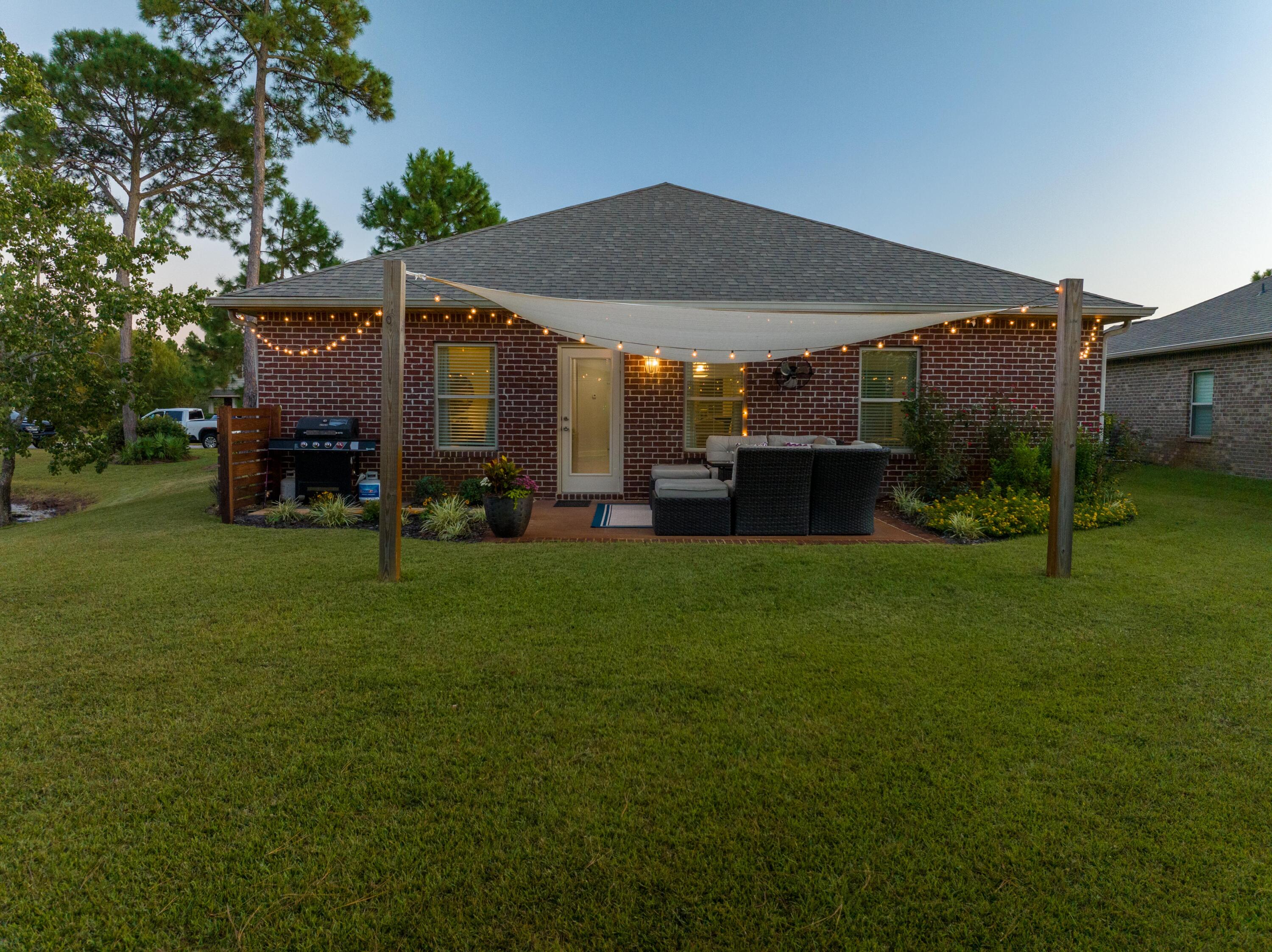 1069 Cocobolo Drive Santa Rosa Beach, FL 32459 - Photo 20 of 46 a view of a house with a yard