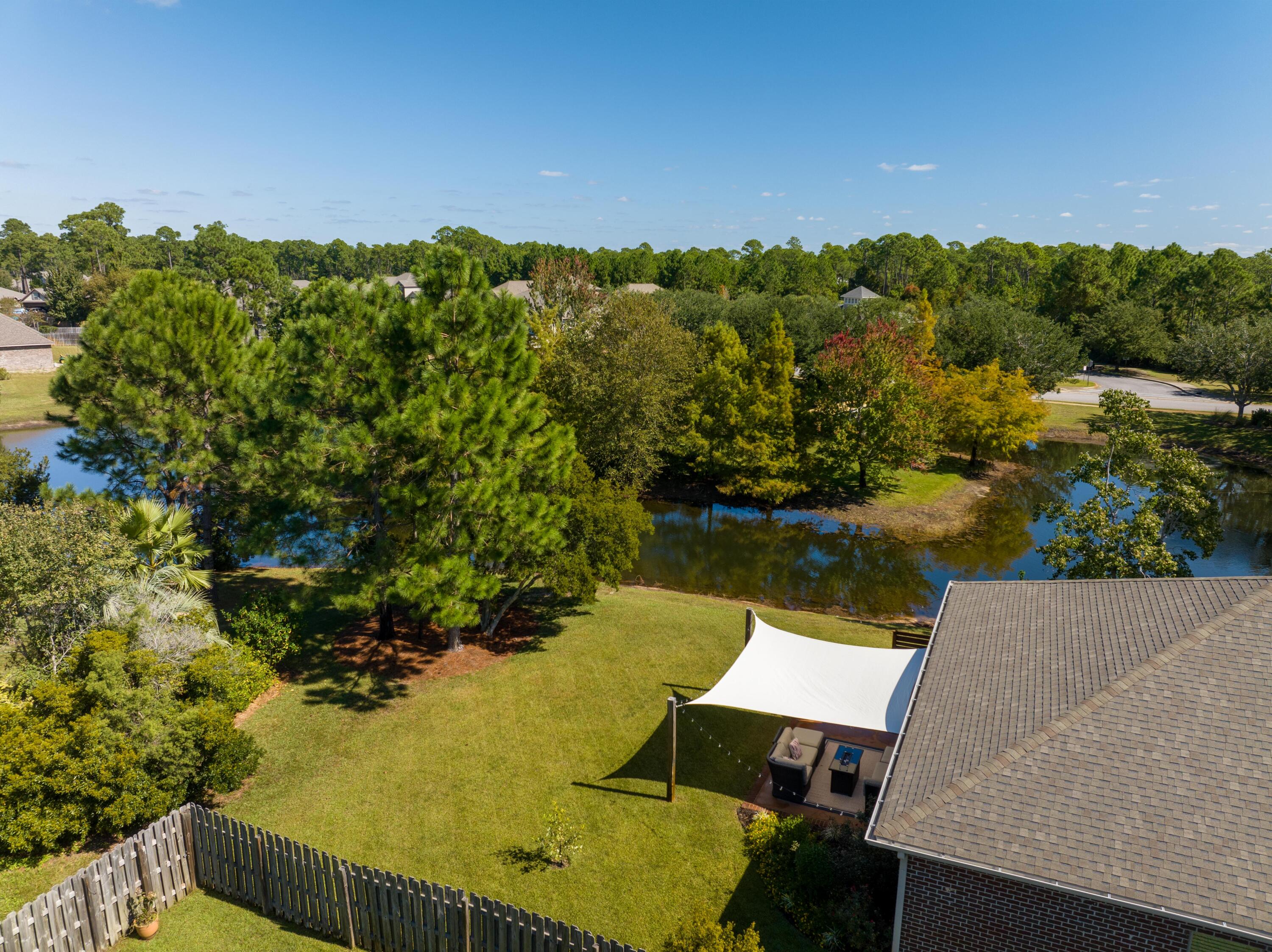 1069 Cocobolo Drive Santa Rosa Beach, FL 32459 - Photo 22 of 46 a view of a lake from a balcony