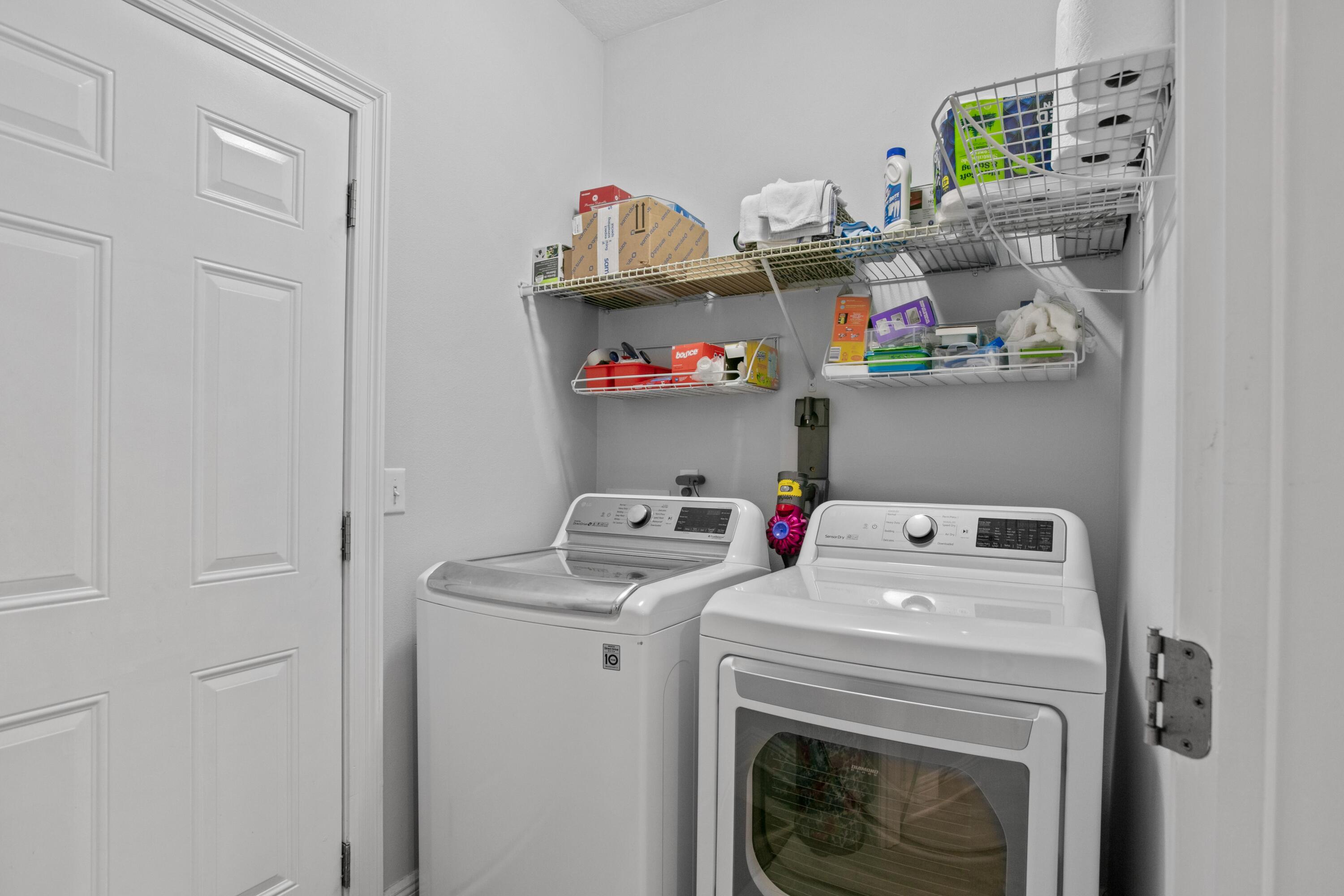 1069 Cocobolo Drive Santa Rosa Beach, FL 32459 - Photo 25 of 46 a utility room with dryer and washer