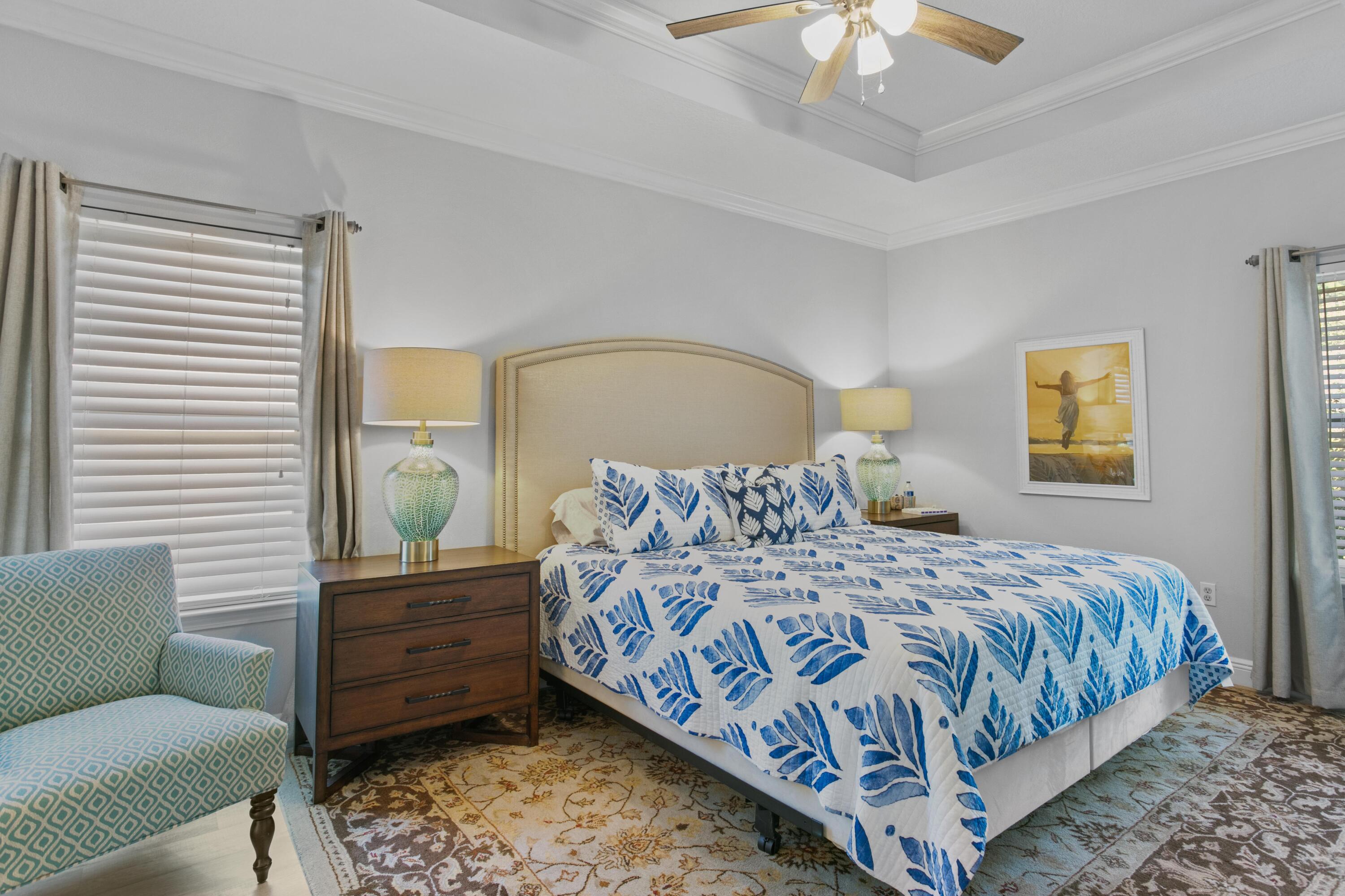 1069 Cocobolo Drive Santa Rosa Beach, FL 32459 - Photo 26 of 46 a bedroom with a large bed couch and a window