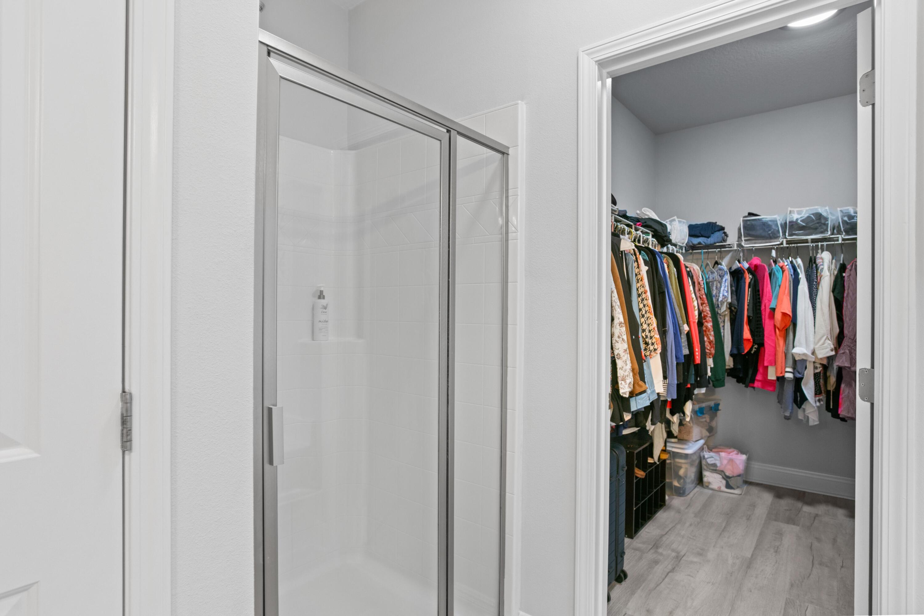 1069 Cocobolo Drive Santa Rosa Beach, FL 32459 - Photo 30 of 46 a view of walk in closet with clothes