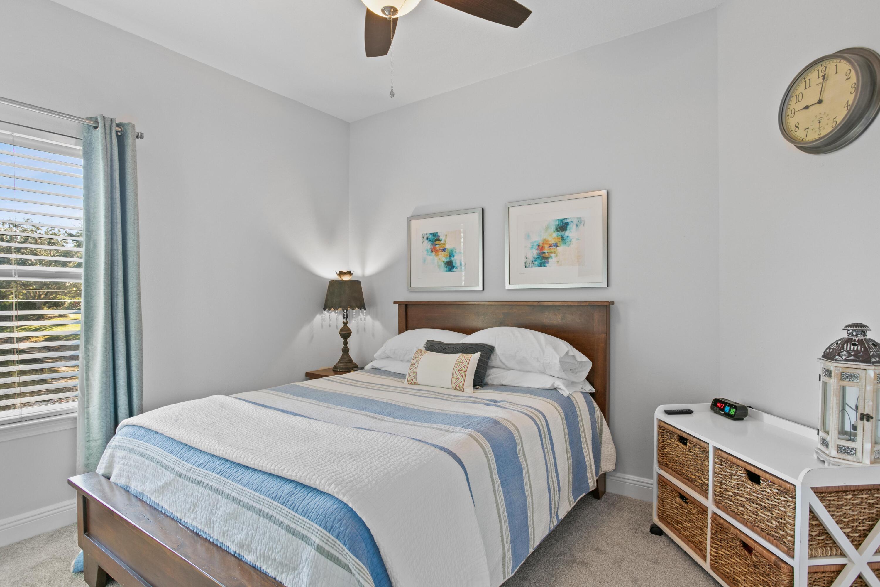 1069 Cocobolo Drive Santa Rosa Beach, FL 32459 - Photo 33 of 46 a bedroom with a bed and a window