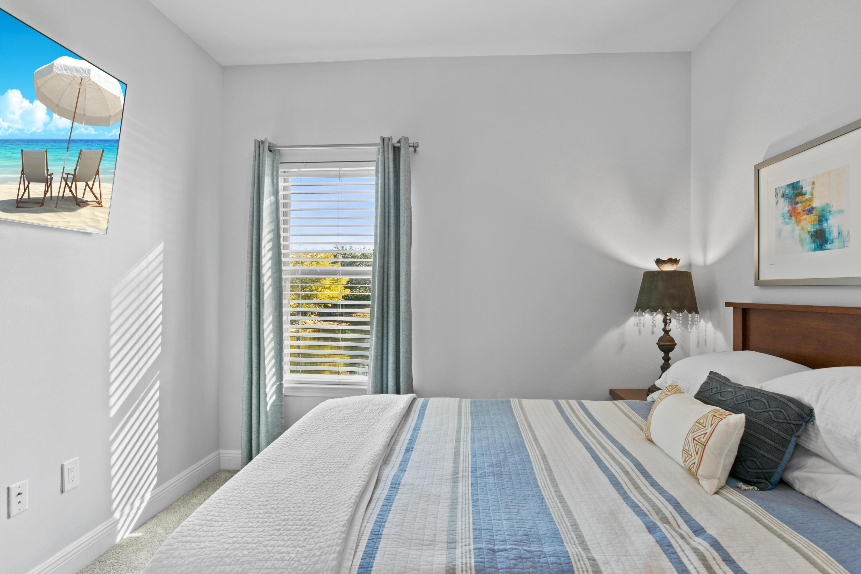 1069 Cocobolo Drive Santa Rosa Beach, FL 32459 - Photo 34 of 46 a bedroom with a bed and a window
