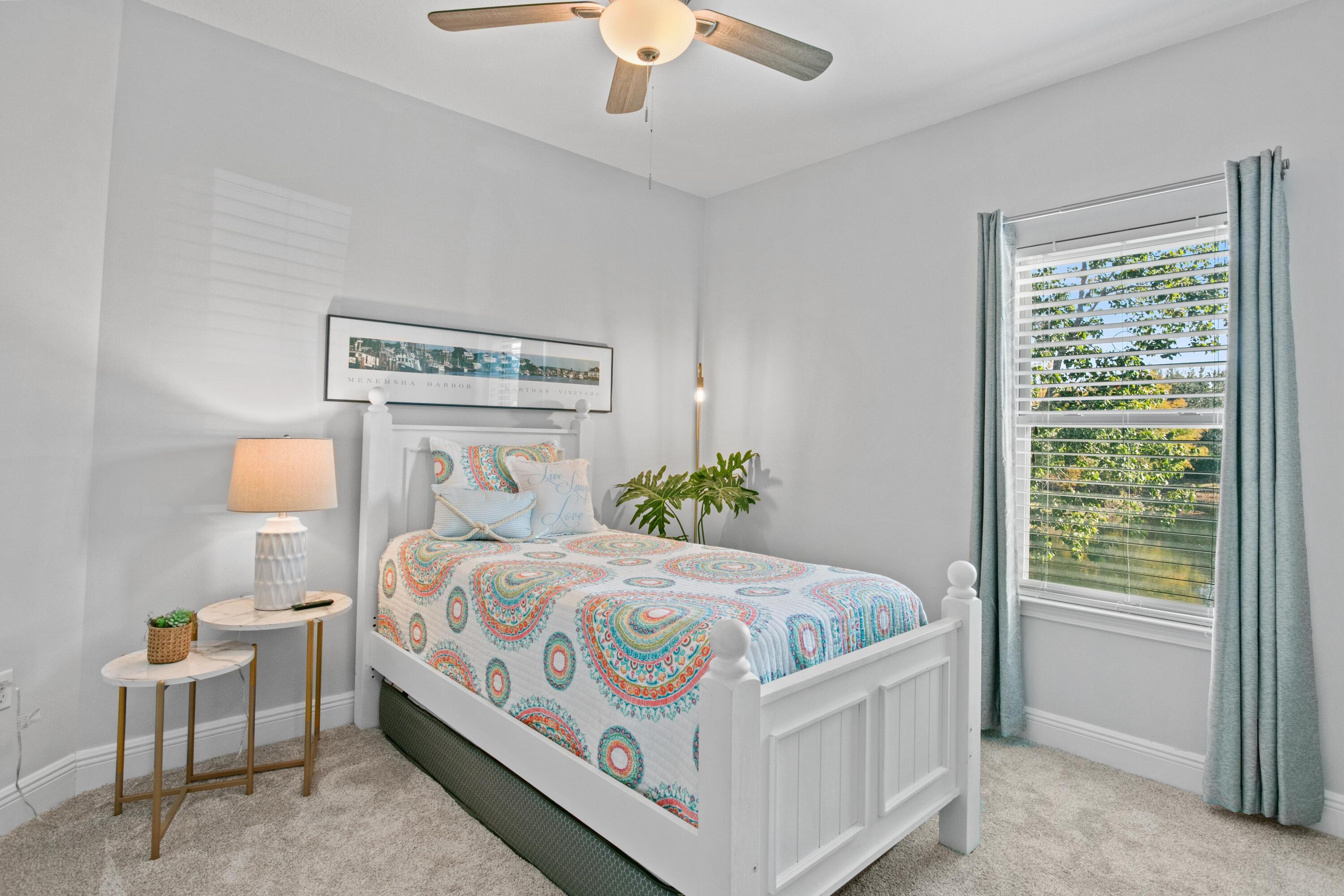1069 Cocobolo Drive Santa Rosa Beach, FL 32459 - Photo 36 of 46 a bedroom with a bed table and window