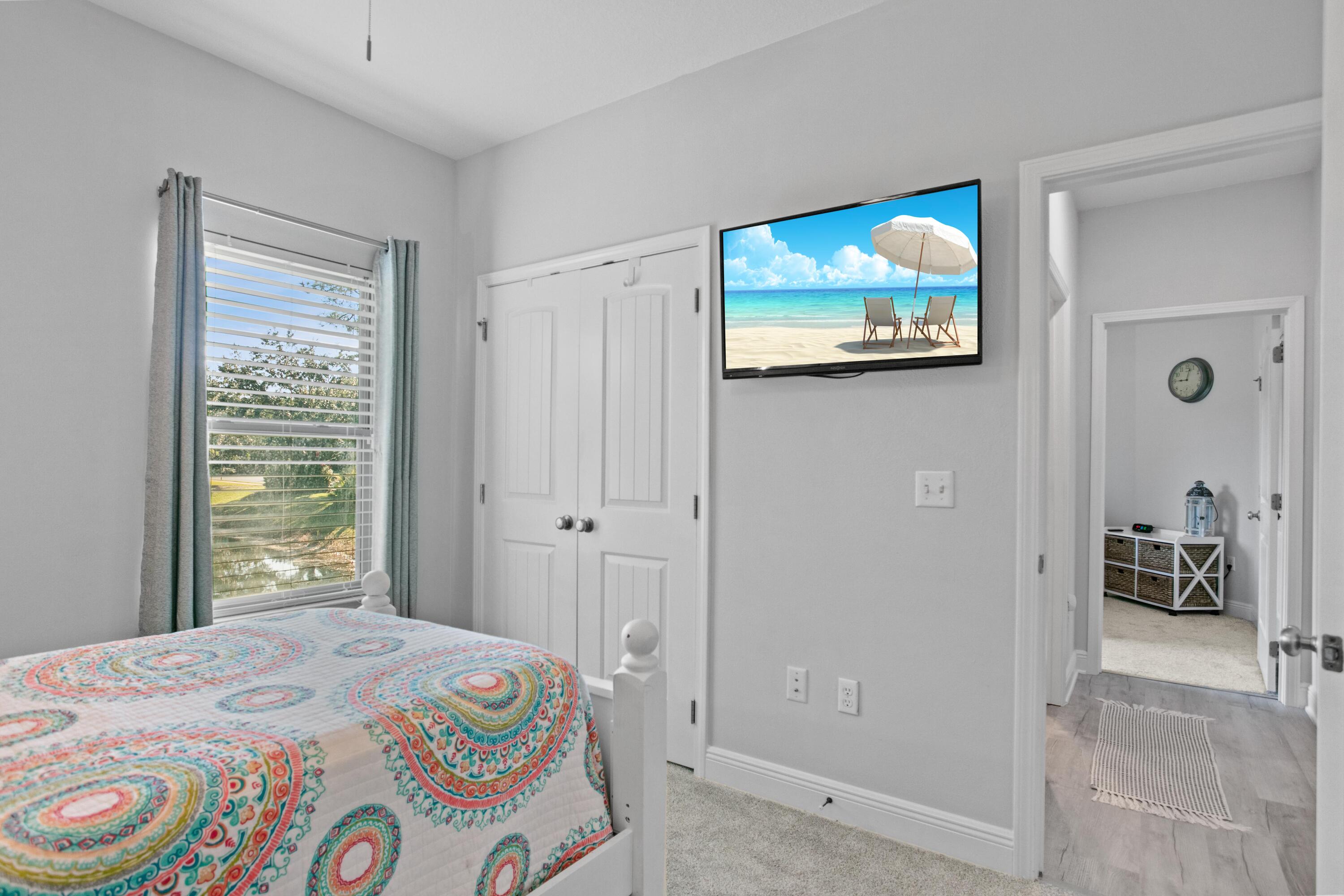 1069 Cocobolo Drive Santa Rosa Beach, FL 32459 - Photo 37 of 46 a bedroom with a bed and a view of bathroom