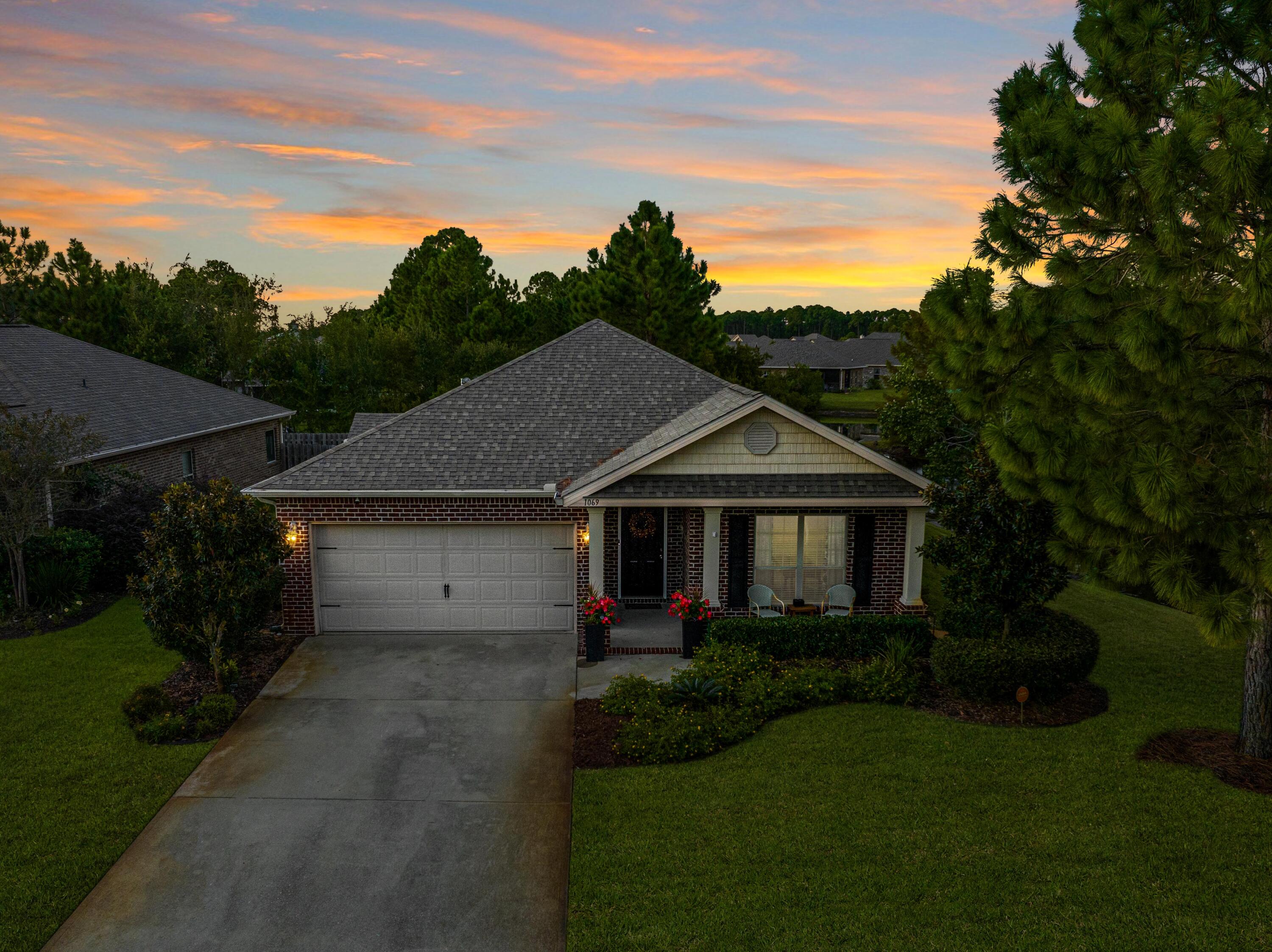 1069 Cocobolo Drive Santa Rosa Beach, FL 32459 - Photo 4 of 46 a house view with a garden space