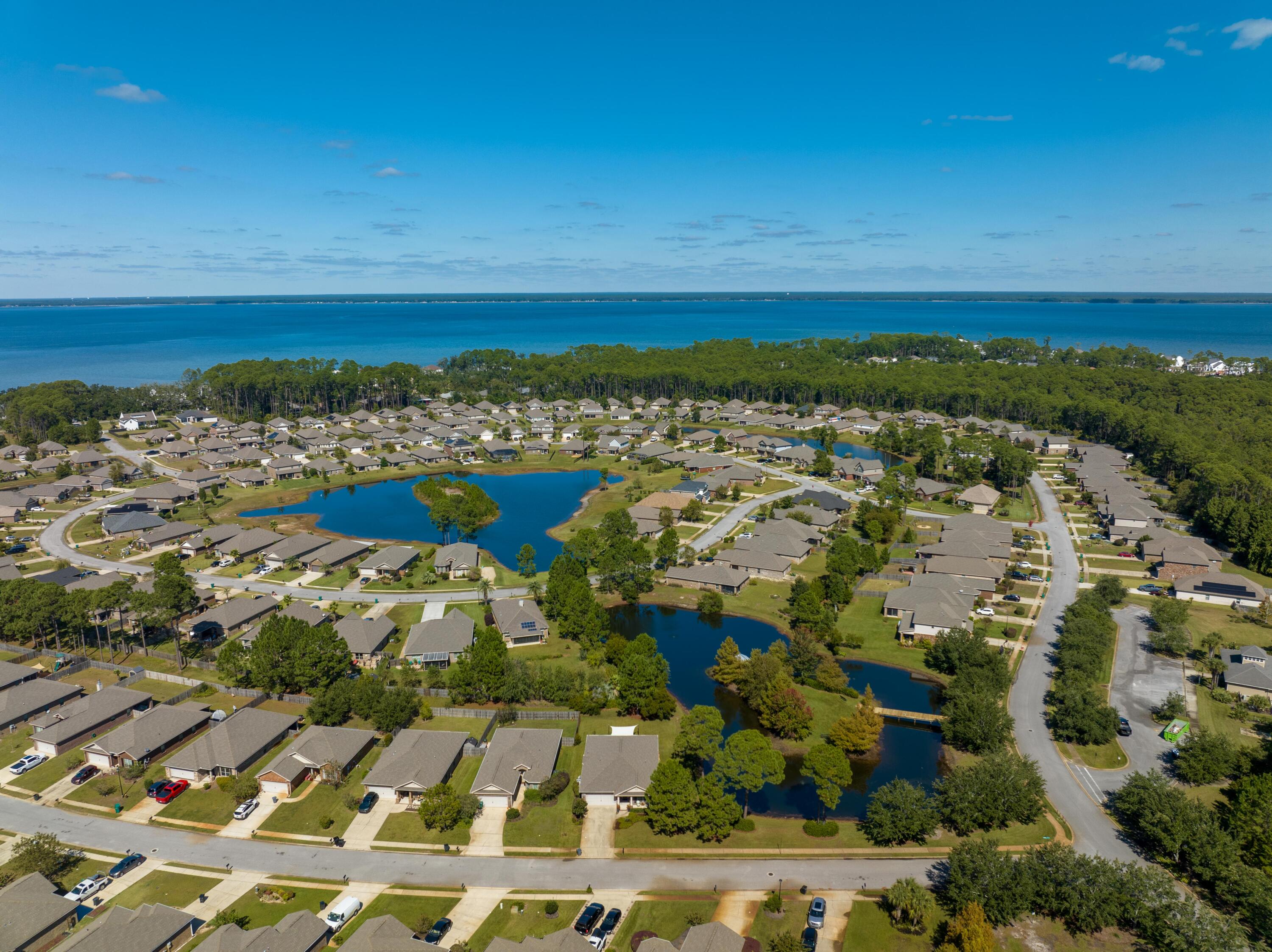 1069 Cocobolo Drive Santa Rosa Beach, FL 32459 - Photo 42 of 46 a view of a city with an ocean
