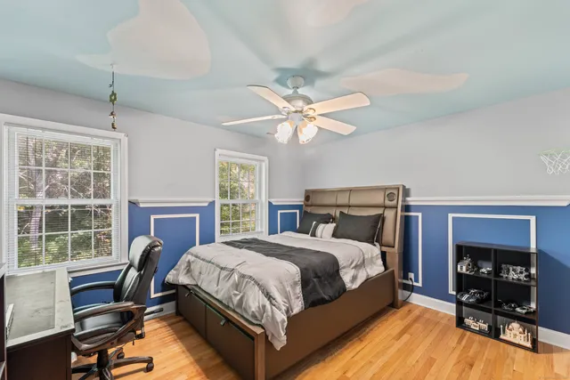 a bedroom with a bed and a table