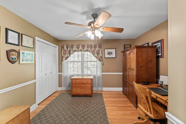 a view of hall way with furniture and a chandelier