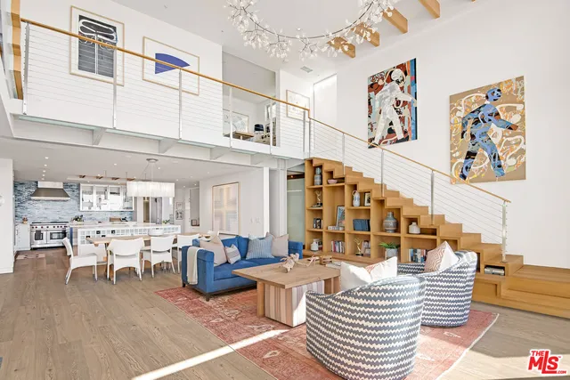 a living room with lots of furniture and decor