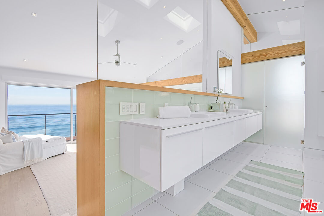 23536 Malibu Colony Road Malibu, CA 90265 - Photo 22 of 44 a bathroom with a double vanity sink mirror and