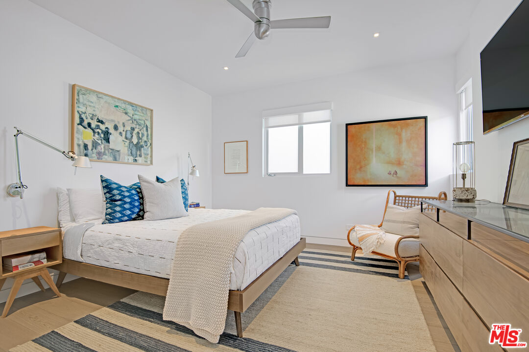 23536 Malibu Colony Road Malibu, CA 90265 - Photo 25 of 44 a bedroom with a bed and a flat screen tv