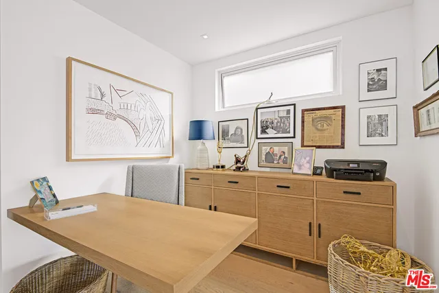 a large white kitchen with stainless steel appliances granite countertop a stove a sink and a refrigerator