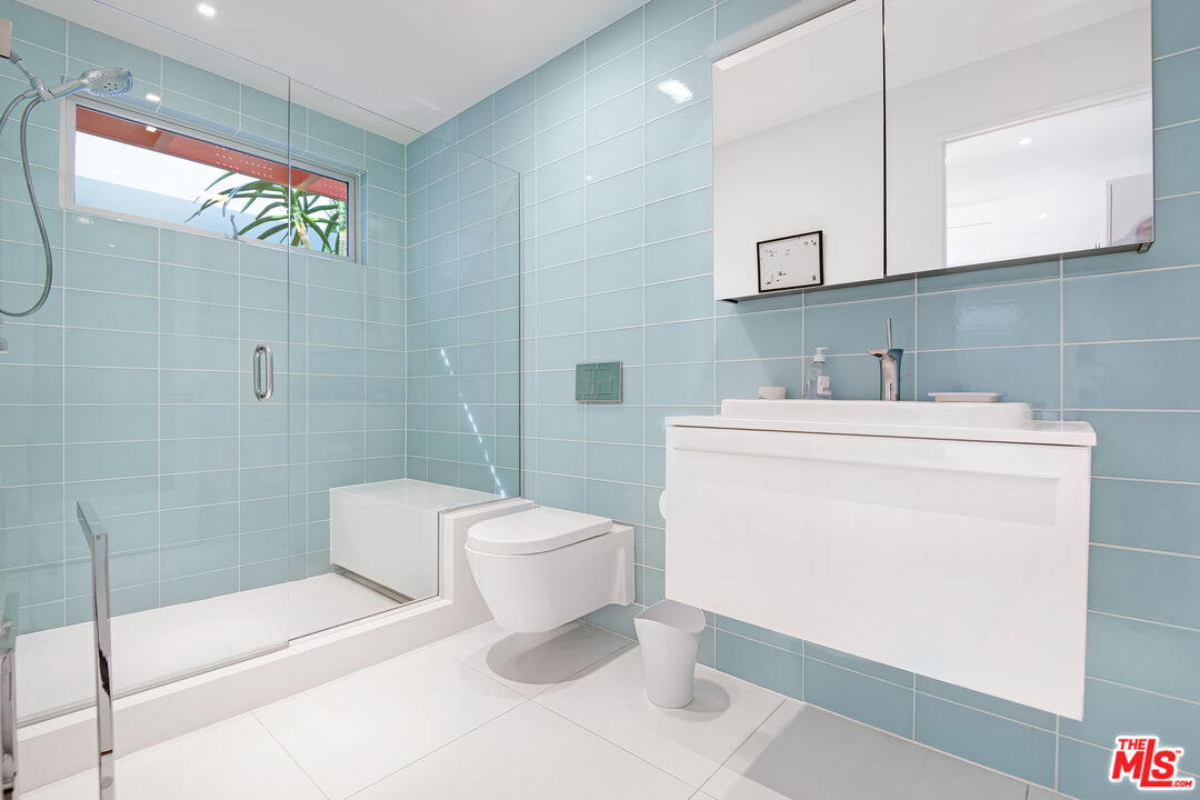 23536 Malibu Colony Road Malibu, CA 90265 - Photo 28 of 44 a bathroom with a sink a toilet and shower