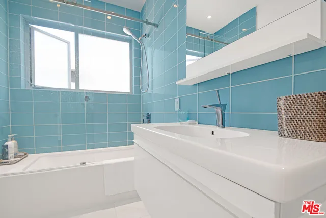 a bathroom with a sink and a bathtub