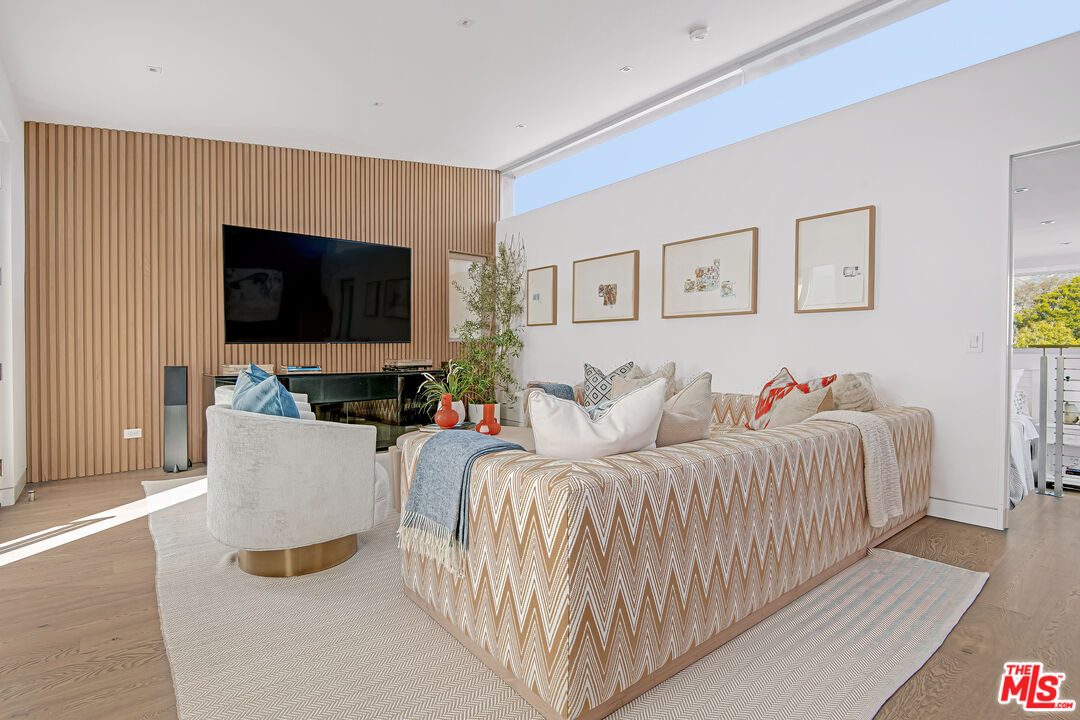 23536 Malibu Colony Road Malibu, CA 90265 - Photo 31 of 44 a living room with furniture and a flat screen tv