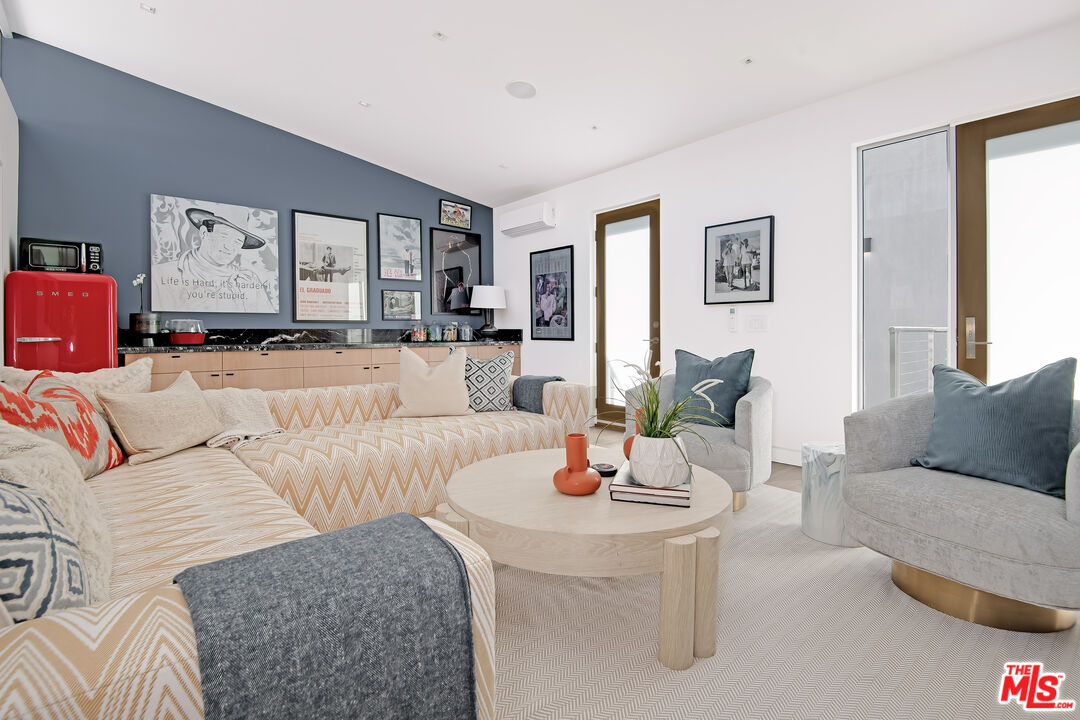 23536 Malibu Colony Road Malibu, CA 90265 - Photo 32 of 44 a living room with furniture and a wooden floor