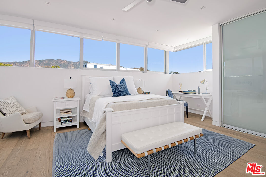 23536 Malibu Colony Road Malibu, CA 90265 - Photo 34 of 44 a bed room with a bed and a chair