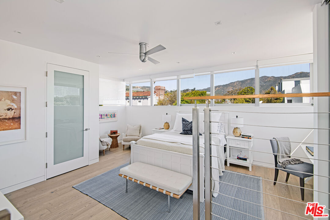 23536 Malibu Colony Road Malibu, CA 90265 - Photo 36 of 44 a bedroom with furniture and a table