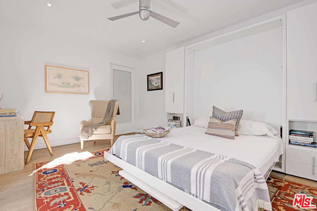 23536 Malibu Colony Road Malibu, CA 90265 - Photo 37 of 44 a bedroom with a bed and wooden floor