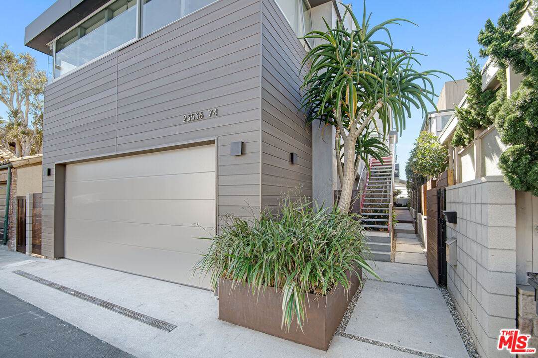 23536 Malibu Colony Road Malibu, CA 90265 - Photo 40 of 44 a potted plant in front of a house