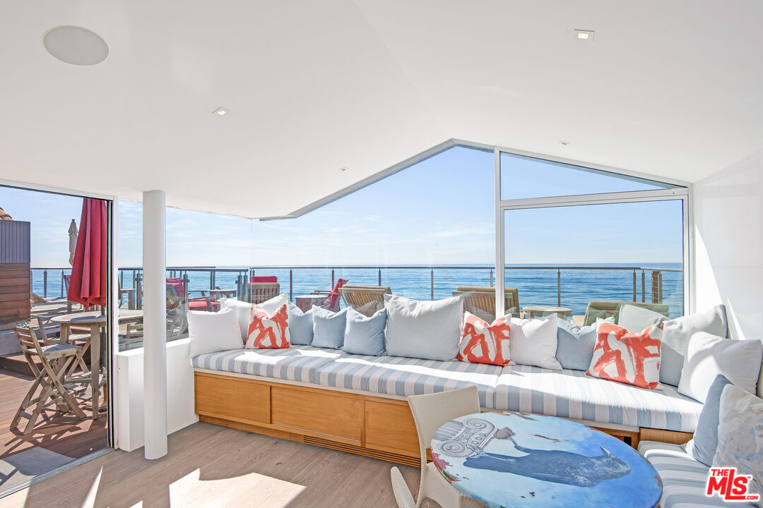 23536 Malibu Colony Road Malibu, CA 90265 - Photo 5 of 44 a living room with furniture and a lamp