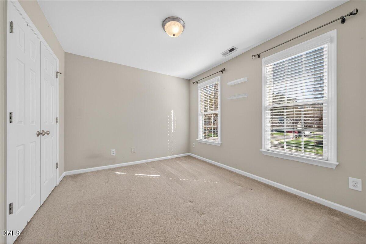 517 Lemon Pepper Place Wendell, NC 27591 - Photo 16 of 19 a view of an empty room with a window