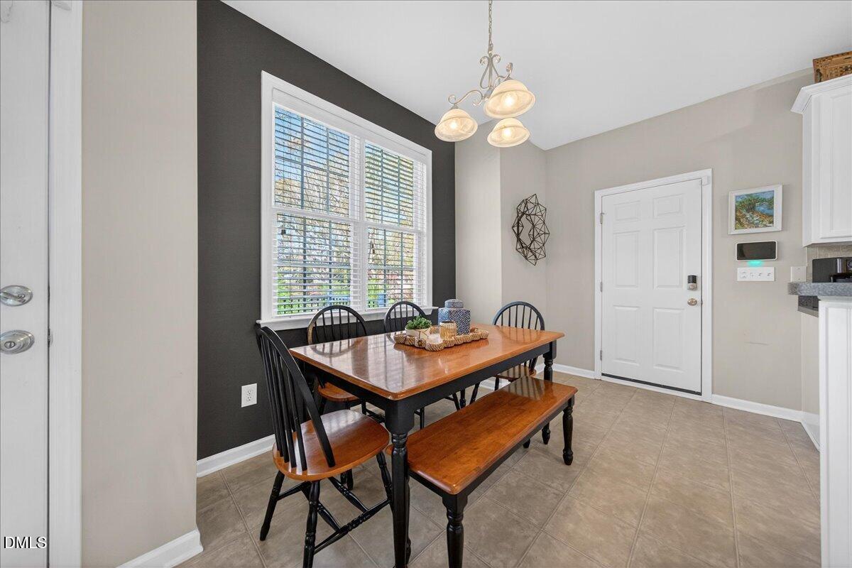 517 Lemon Pepper Place Wendell, NC 27591 - Photo 8 of 19 a dining room with furniture and window