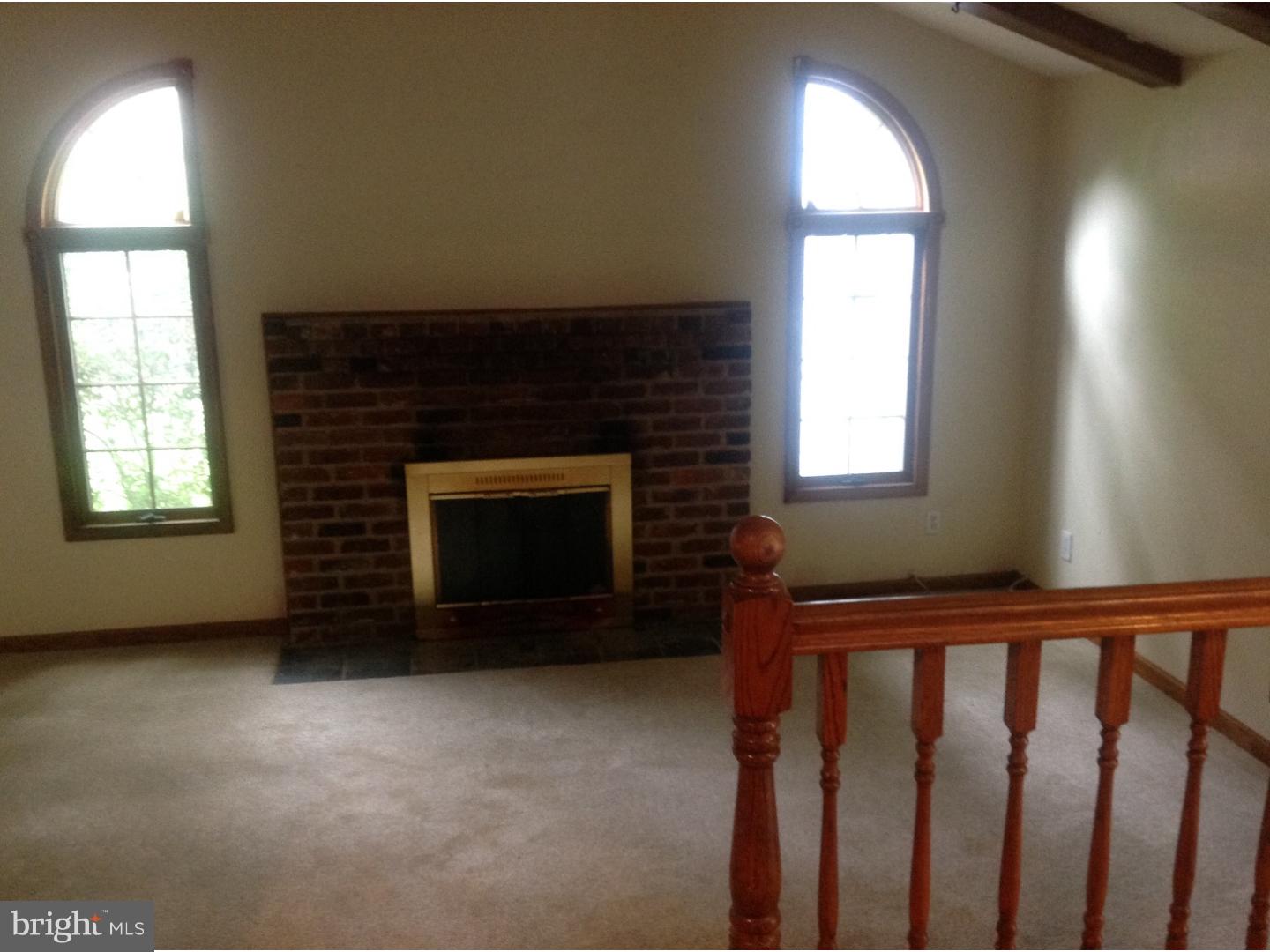 16 Oniontown Road Medford, NJ 08055 - Photo 7 of 25 a living room with a fireplace in it