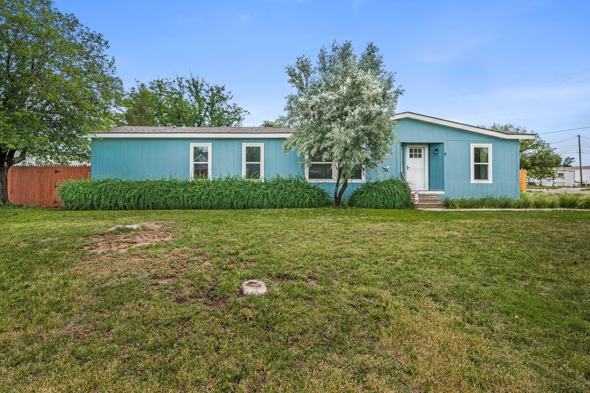200 5th Avenue Canyon, TX 79015 - Photo 1 of 18 a view of a house with yard and a tree