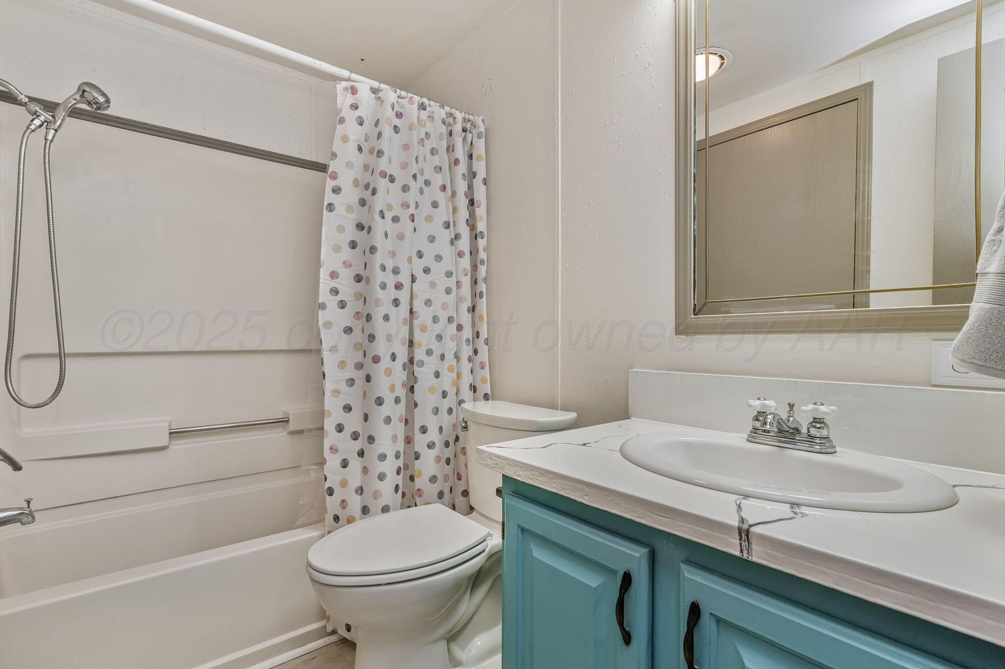 200 5th Avenue Canyon, TX 79015 - Photo 14 of 18 a bathroom with a sink toilet and shower