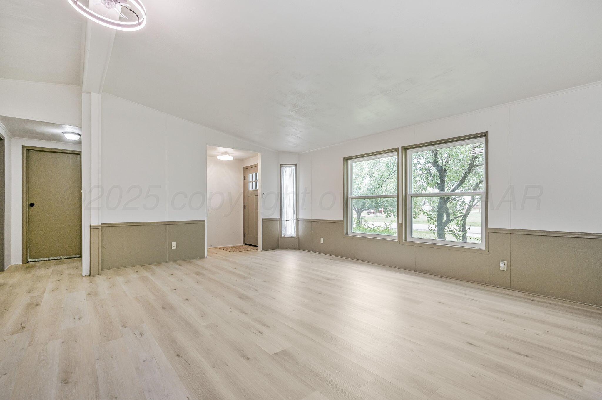 200 5th Avenue Canyon, TX 79015 - Photo 3 of 18 a view of an empty room with a window