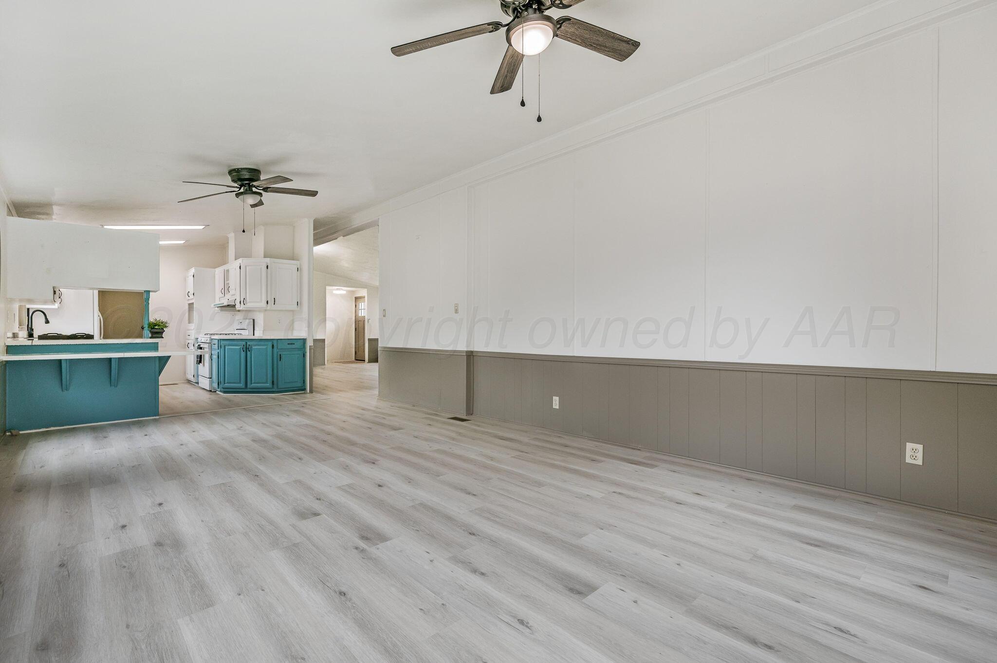 200 5th Avenue Canyon, TX 79015 - Photo 5 of 18 wooden floor in an empty room with a window