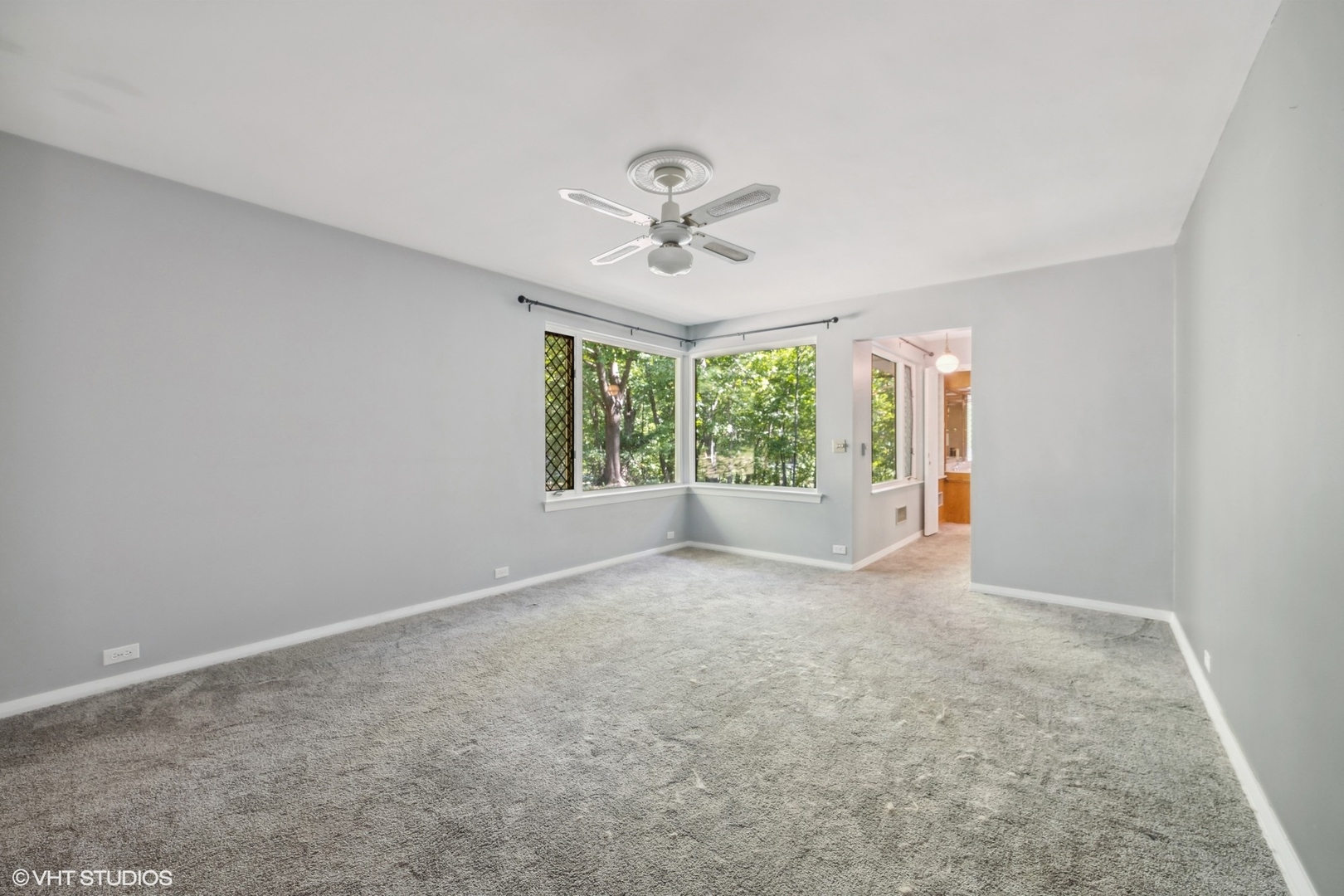 609 Ravine Road East Dundee, IL 60118 - Photo 13 of 15 an empty room with windows and ceiling fan