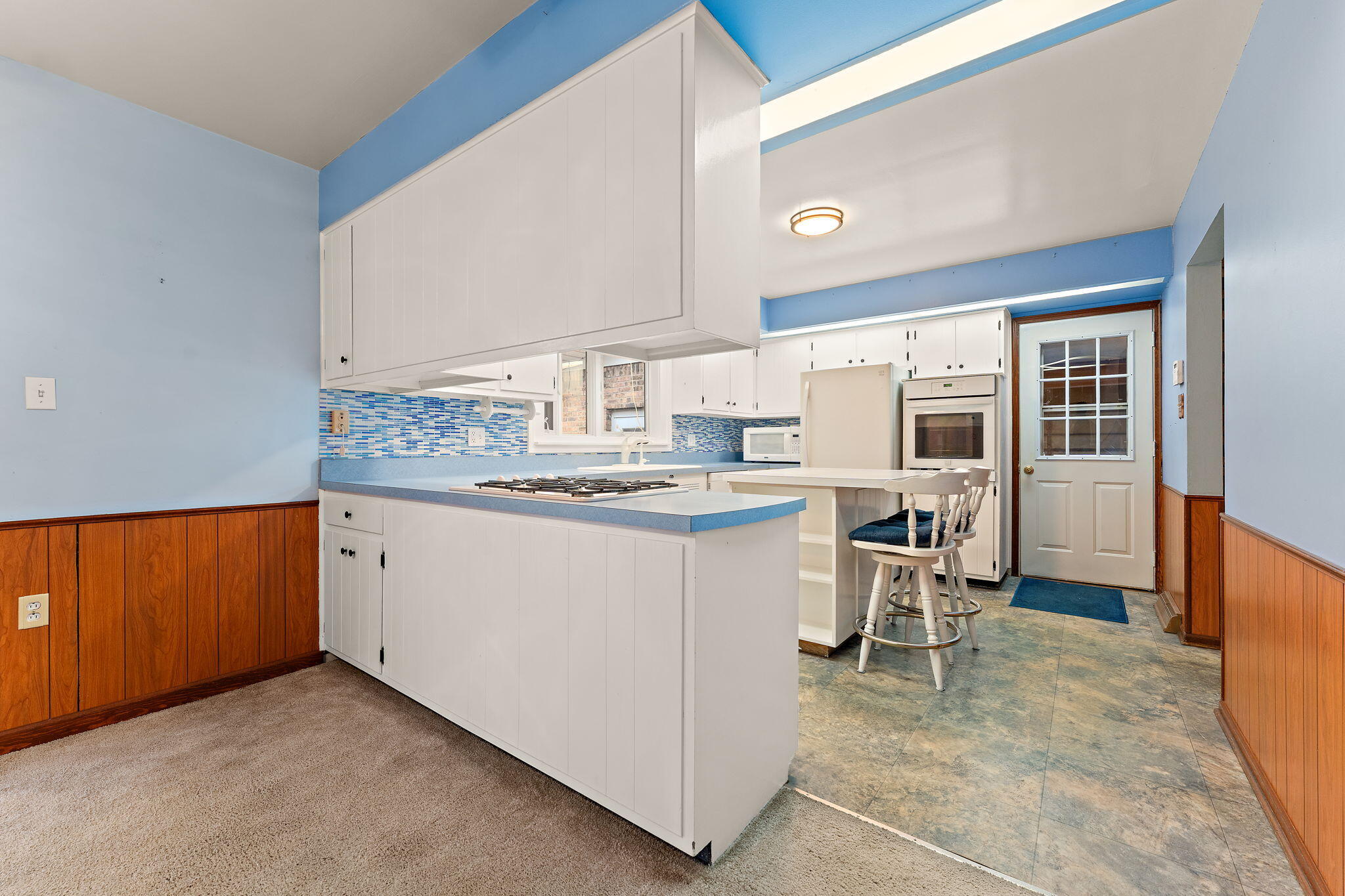 1012 Meridian Road Chesterton, IN 46304 - Photo 12 of 39 a kitchen with a sink cabinets and window