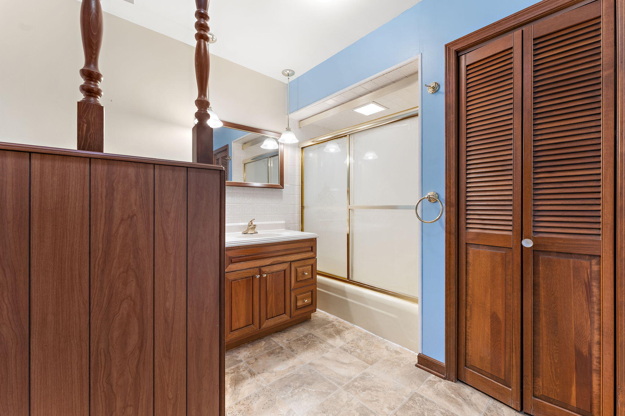 1012 Meridian Road Chesterton, IN 46304 - Photo 17 of 39 a bathroom with a glass door shower and a sink