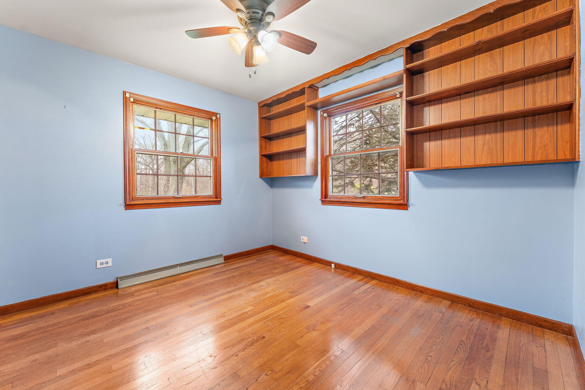1012 Meridian Road Chesterton, IN 46304 - Photo 19 of 39 a view of an empty room with a window and wooden floor
