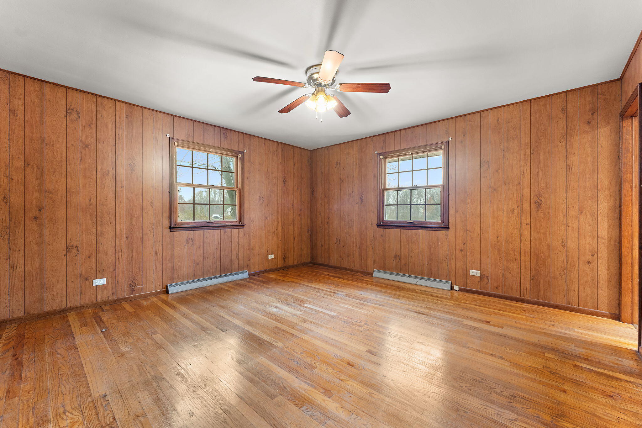 1012 Meridian Road Chesterton, IN 46304 - Photo 20 of 39 an empty room with windows and ceiling fan