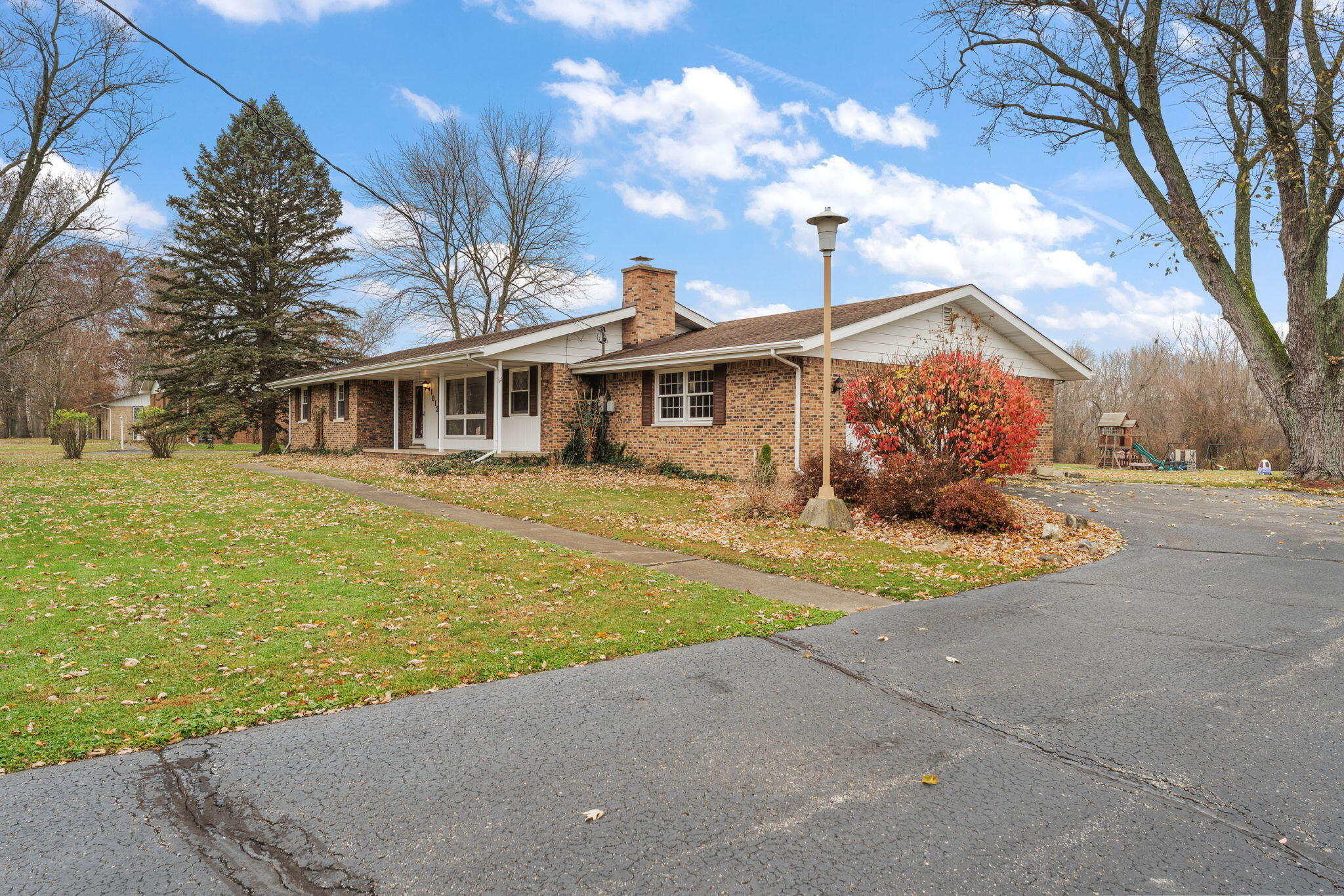 1012 Meridian Road Chesterton, IN 46304 - Photo 4 of 39 a front view of a house with a yard and lake view
