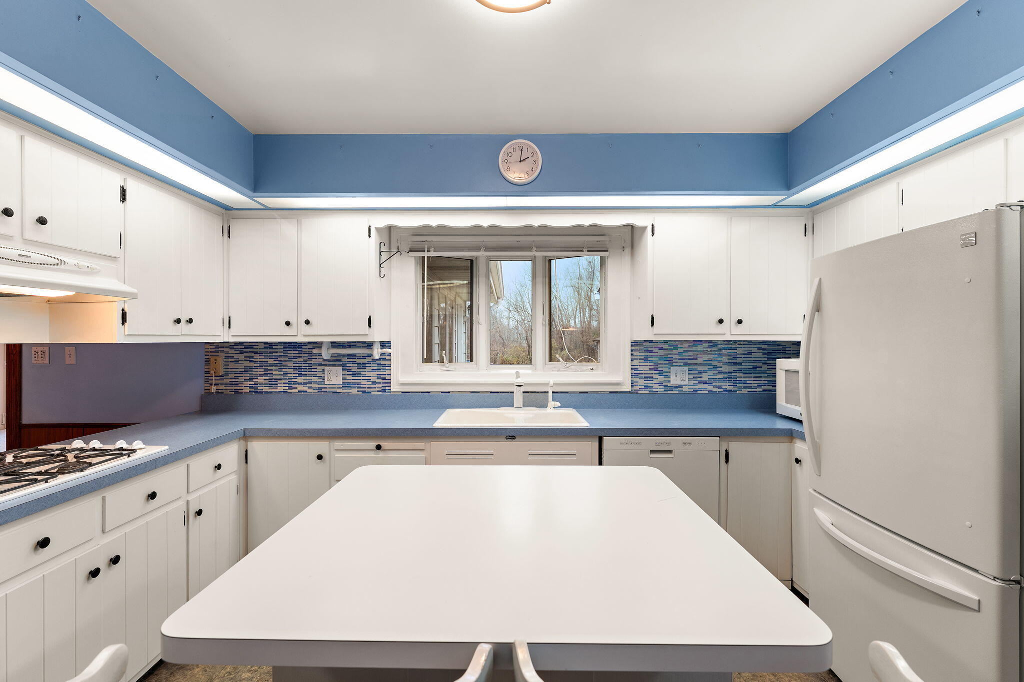 1012 Meridian Road Chesterton, IN 46304 - Photo 10 of 39 a kitchen with granite countertop a sink a stove and refrigerator